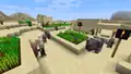 A group of pillagers raiding a village, shown at MINECON Earth 2018.