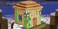 Kai outside a Minecraft brand gingerbread house.