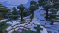 A snowy taiga that generated bordering a grove. Notice how the snowy taiga uses grass blocks with snow layers as its top layer, while the grove uses snow blocks.