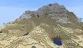 Snowy mountain biomes would generate directly next to hot biomes in early caves and cliffs development - this is why the stony peaks biome was added.