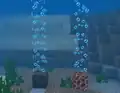 Bubble columns created by soul sand and magma block in Bedrock Edition with fancy bubbles disabled.