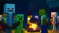 Several monsters in front of a campfire.