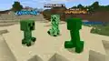 Creepers representing Minecraft Dungeons, Minecraft Legends, and Minecraft looking at each other.[2]