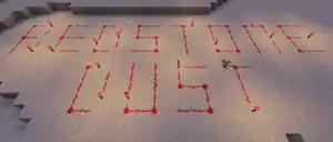 A screenshot of a trail of redstone dust forming the words "redstone dust".