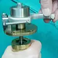 1. Thread the micrometer spindle back into the nut in the cylinder.