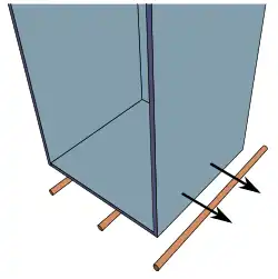 To wheel an assembled cabinet on make-shift rollers may look weird, but is a simple and wholesome alternative to heavy lifting.