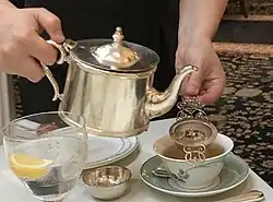 Tea poured through a strainer to filter out loose leaves
