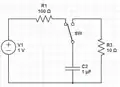 Capacitor charging and discharging circuit separated by a switch