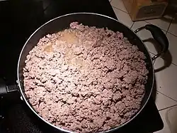 Cooking the beef until browned