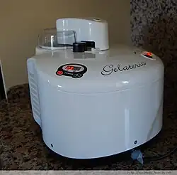 Electrically-powered machine chilled with a compressor