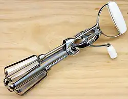 An egg beater or hand-cranked mixer