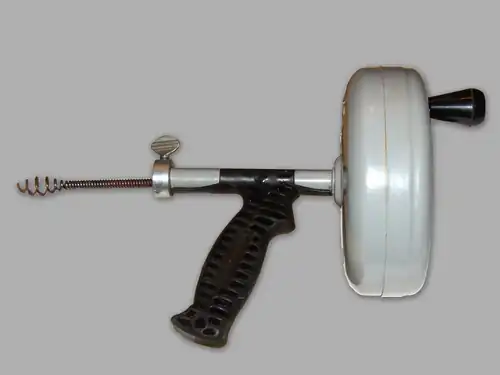 A handheld drain auger