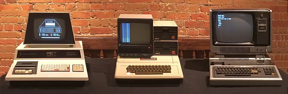 Common computers released in 1977, the Commodore PET 2001, the Apple II, and the TRS-80 Model I.