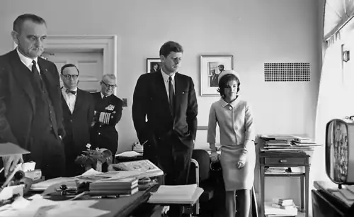 President Kennedy watches the flight of Alan Shepard on Television.