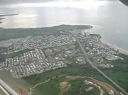 Aerial view of a coastal city from inland