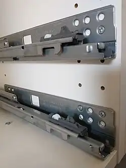 Notice that the bottom slide is mounted through the upper holes