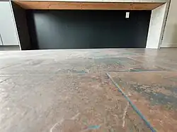 …to match the shape of the countertop waterfall on the opposite side of the bar.