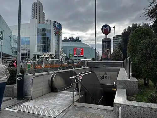 Şişli—Mecidiyeköy metro station entrance in front of the mall]]