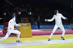 Russian Igor Turchin (left) and American Weston Kelsey (right) duel in second round of men's individual épée