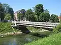 The bridge at its second location near the Ljubljana University Medical Centre. A district heating pipeline marks its appearance.