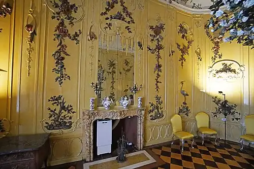 Rococo – fourth guest room, so-called Voltaire Room, Sanssouci, Potsdam, Germany, designed by Georg Wenzeslaus von Knobelsdorff, with decoration by Johann Michael the Elder and Johann Christian Hoppenhaupt the Younger, 1752–1753[39]