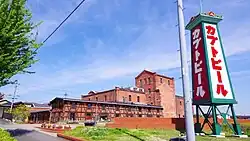 Kabuto beer advertising tower and red brick building