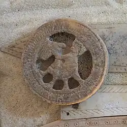 Seated figure with hawk