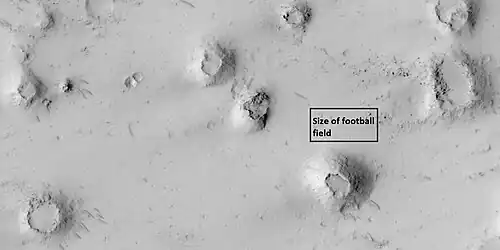 Close view of cones with the size of a football field shown, as seen by HiRISE under HiWish program