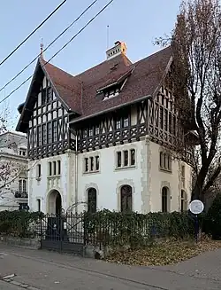 Tudor Revival - Dr. Petre Herescu House on Bulevardul Dacia, Bucharest, by Grigore Cerchez, 1911-1913[53]