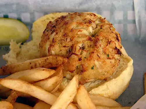 A crab cake served atop a bun