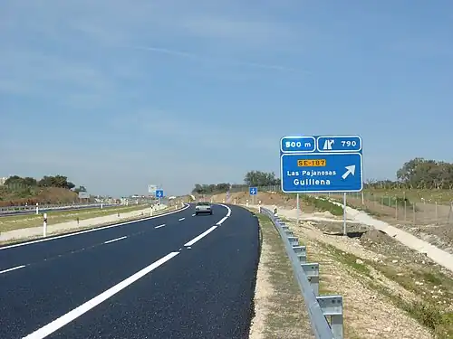 Modern autovías (expressway) such as the A-66 near Guillena, Seville, offer most, if not all, features that are required by an autopista (motorway).