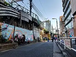Alley between the Yamanote Line and Shinjuku Kaleido Building, featured in an early police investigation scene.