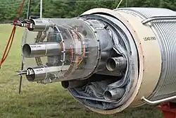 An arc dipole magnet. Electrical bus slots (top and bottom) and beam tube (middle) at the top section of the vacuum shell[18]