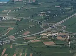 An aerial view of motorway cloverleaf interchage