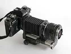 Bellows fitted between an SLR and reversed lens