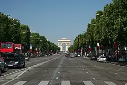 View at pedestrian level as seen from the middle of the avenue looking west.