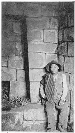 Martín Chambi (Peru) photo of a man at Machu Picchu, published in Inca Land. Explorations in the Highlands of Peru, 1922