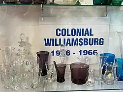 display of Colonial Williamsburg glassware in clear, dark purple, and blue