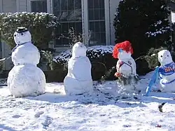 A "snow family" in Boise, Idaho, with various accessories