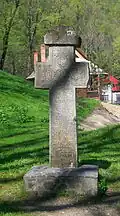 19th-century stone cross placed in the park