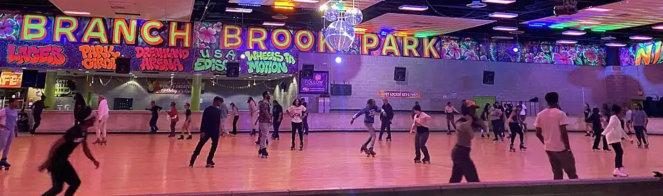 Branch Brook Park Roller Skating Center in Newark, New Jersey, featuring live DJs and a disco ball, in 2024