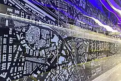 The side wall of the large character wall on Line 8 platform uses satellite images as the background