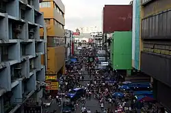 Busy street as seen from above with many pedestrians