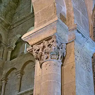 Corinthian capital decorated with anthropomorphic figures.