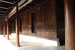 Wooden-panel walls (arayum) and verandah (chuttu). Wooden houses follow a traditional prefabricated system of construction.