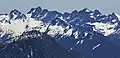 Burn Boot Peak centered, west aspect as seen from Preacher Mountain. Overcoat Peak, Chimney Rock, and Lemah Mountain in the background