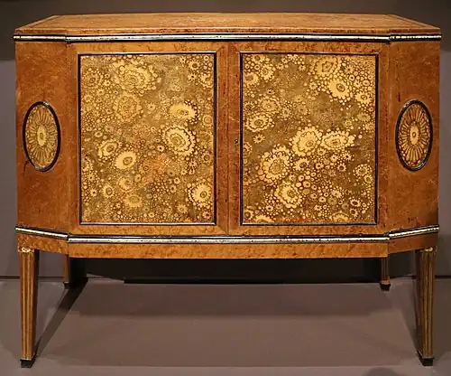 Chest of drawers, a highly simplified reinterpretation of the Louis XVI style; by Clément Mère; 1910; maple, ebony, leather and ivory; 87.5 x 96 x 37 cm; Musée d'Orsay, Paris[111]