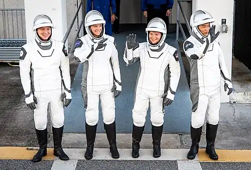 Crew-10 astronauts walk out from the O&C Building