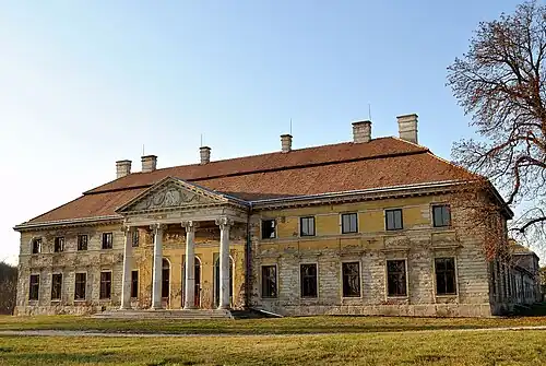 A large building with four columns at the entrance