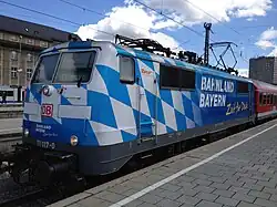 DB 111 017 with special paintwork "Bahnland Bayern" at Munich Hauptbahnhof in June 2012